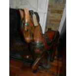 A pair of carved and painted hardwood horses.