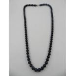 Tiffany & Co. A black onyx beaded necklace, in original case.