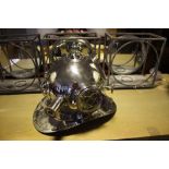 A chrome plated model of a vintage diving helmet