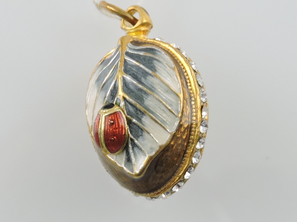 A Russian gilt egg pendant,