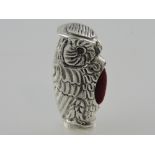 A white metal pin cushion cast in the form of an owl, stamped 925 to the base, H. 5cm.
