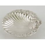 A white metal scallop shaped dish, with foliate border, 3ozt.