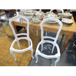 A set of four Louis XVI style grey painted chair frames,
