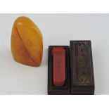 A soapstone seal, in the form of a mountain carved with a figure and temple,