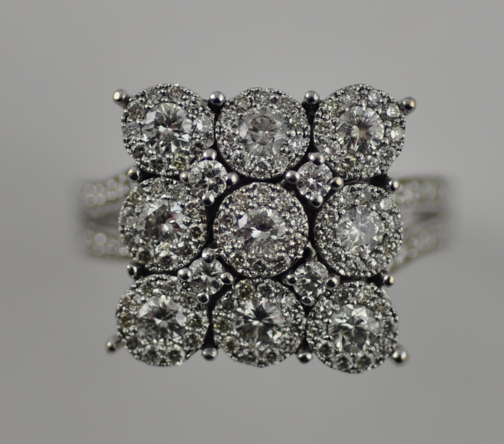 An 18ct white gold large cluster diamond ring in the form of a square, total 1.4ct.