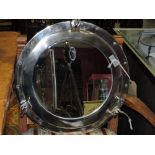 A chrome-plated port hole style mirror, D. 43cm.