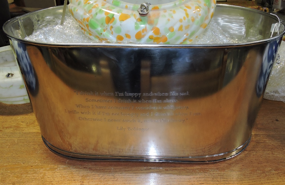 A stainless steel champagne bath, bearing Napoleonic quote, W. 62cm.