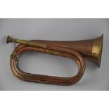 A 20th century copper and brass bugle, L. 28cm.