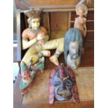Five South East Asian carved wood figures