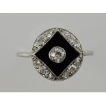 A diamond and onyx plaque dress ring, filigree set in white metal, 2.5g.