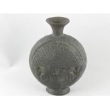 A pre-Columbian Peruvian chimu type black figural ceramic vessel with deity,