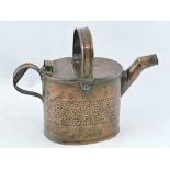 A Newlyn copper water can of lidded oval form, the body with a speckled band and a canted spout,