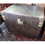A pair of globetrekker style brass mounted tan leather steamer trunks with strap handles, W. 60cm.