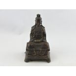 A bronze figure of Buddha, raised on a rectangular plinth, H. 24cm.