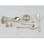 Five Edwardian silver teaspoons, with pierced terminals, one other silver teaspoon, a plated spoon,