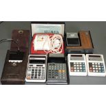 A Rockwell 51R electronic calculator, with cover, instructions and extension lead,