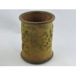 A carved bamboo brush pot, decorated with birds and trees in a landscape, H. 19cm.