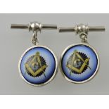 A pair of white metal bar and chain cufflinks, the circular faces with Masonic emblems.