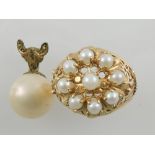 A yellow metal and pearl set dress ring,