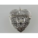 A white metal heart-shaped locket,