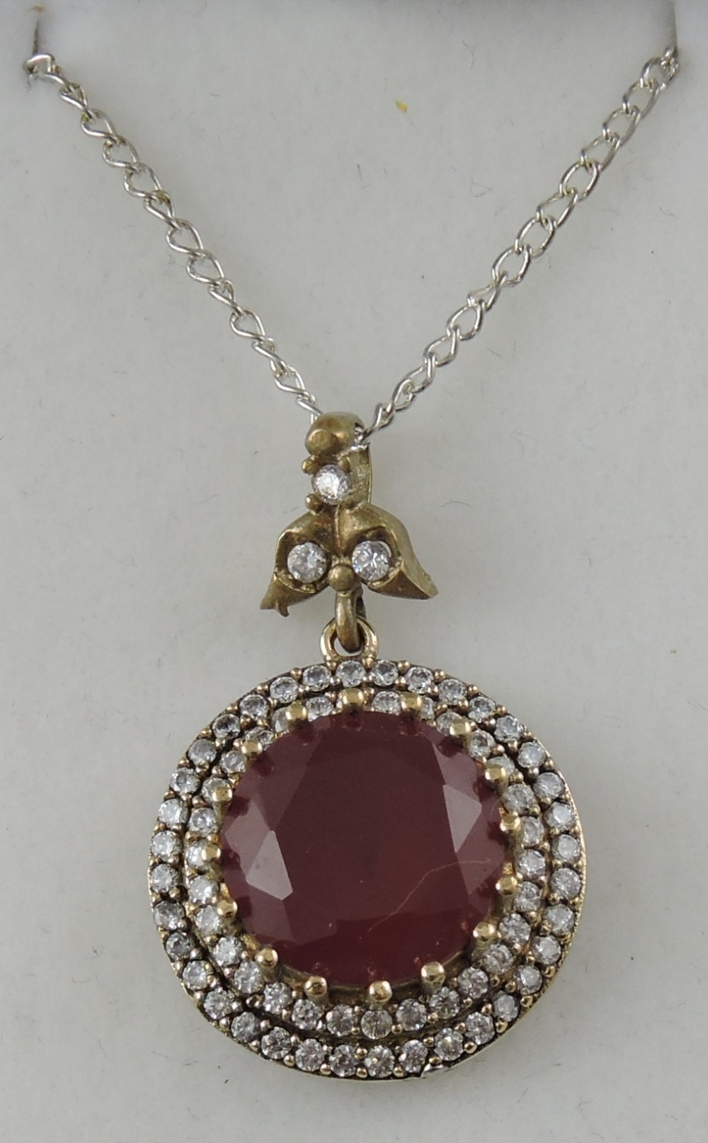 A ruby and cubic zirconia pendant,