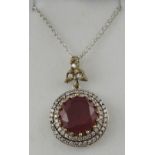 A ruby and cubic zirconia pendant,