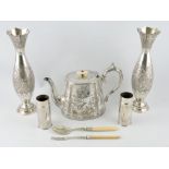 A late Victorian engraved silver-plated teapot, a pair of Eastern silver-plated vases,