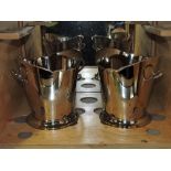 A pair of oval plated two handled wine coolers with beaded rims.