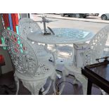A white painted circular aluminium garden table and 3 chairs