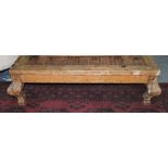 A Mexican pine rectangular coffee table, with studded iron planked top of short cabriole legs, W.