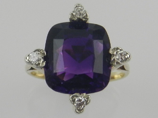 An impressive late 19th / early 20th century yellow gold amethyst and diamond set dress ring,