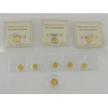 A collection of nine reproduction gold coins.