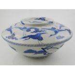 A Chinese blue and white footed bowl and covers,