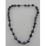 A simulated agate beaded necklace.