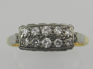 An 18ct yellow gold and platinum set diamond cluster ring, in the Art Deco style,