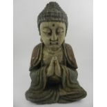 A 19th century caved study of a seated Buddha. H.33cm.
