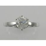 A white metal solitaire diamond ring,
