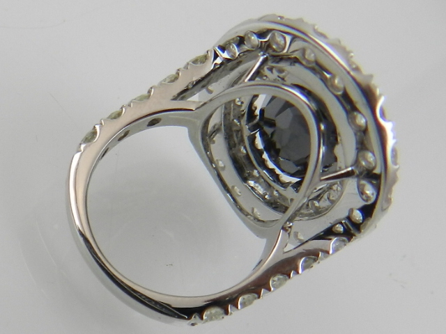 An unusual 18 carat white gold, black diamond, and white diamond cocktail ring, the central black - Image 2 of 2