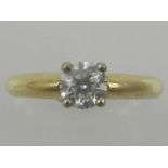 An 18ct yellow gold solitaire diamond ring, set a brilliant cut stone of 0.