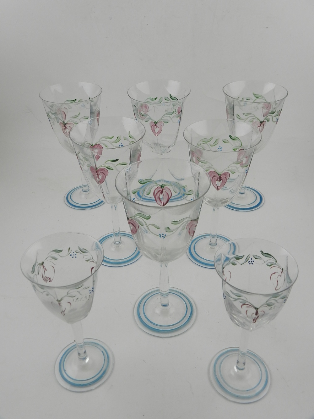 A collection of hand painted wine and sherry glasses.