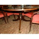 A George III Cuban mahogany circular breakfast table, raised on tripod base and casters. D.