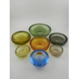 five Whitefriars glass ashtrays, together with two others.