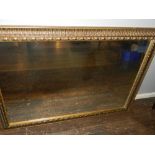 A framed wall mirror. H.73cm W.