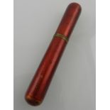 An unusual early 20th century gilt metal mounted and red guilloche enamelled cigar case,
