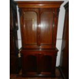 A Victorian mahogany bookcase, having two astral glazed doors above two cupboard doors. H.212cm W.