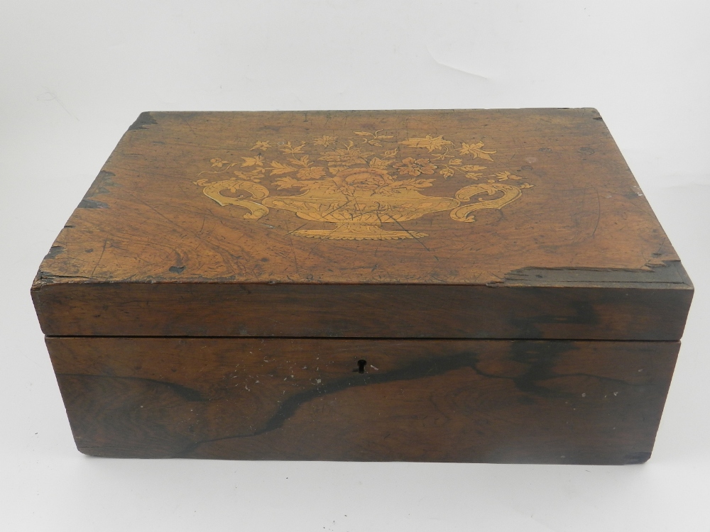 A Victorian rosewood box, inlaid with flower decoration to top.