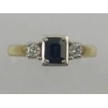 A 9ct yellow gold sapphire and diamond set dress ring in the Art Deco style.