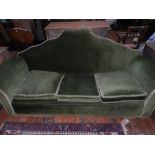 A Queen Anne style three seater sofa, upholstered in green cord fabric.