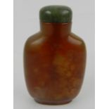 A Chinese agate and glass snuff bottle.