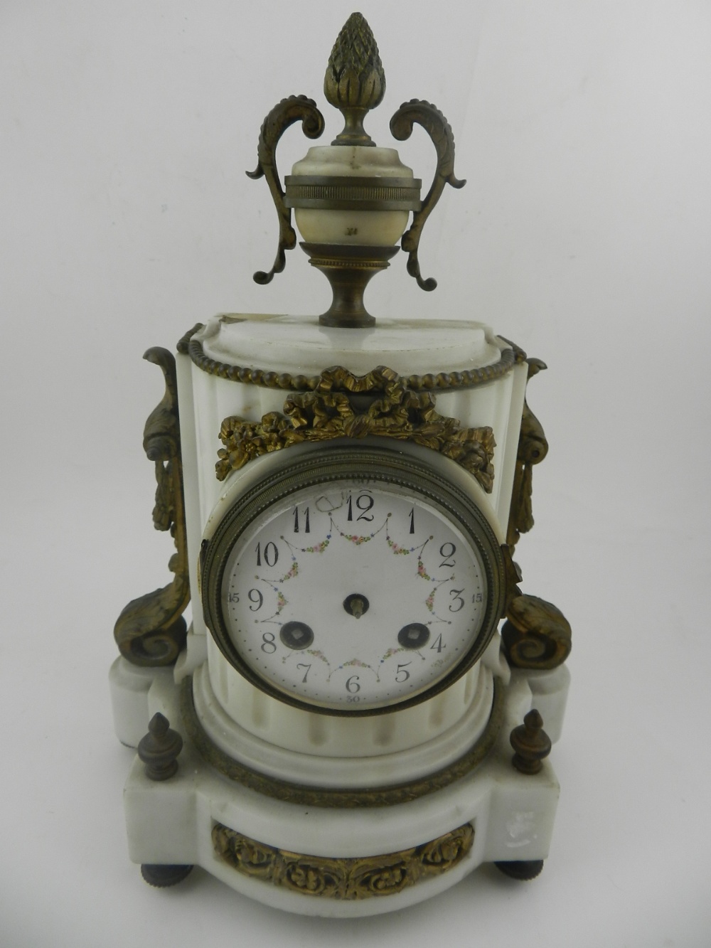 A mid 19th century French Carrara marble and ormolu mounted mantel timepiece in the Louis XVI style,